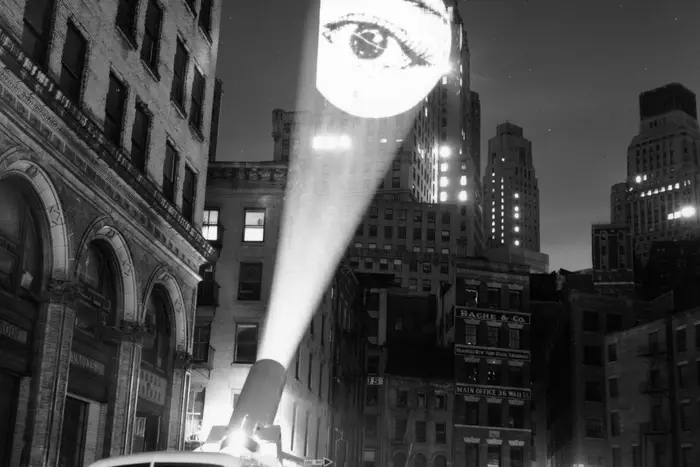 "An image of an eye is projected onto a building at New York by a skyjector. February 1960."